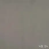 Sicis Nabuk silver fabric swatch, matte gray-silver, fine-grain texture, tightly woven, diffused lighting, brand name in lower right.